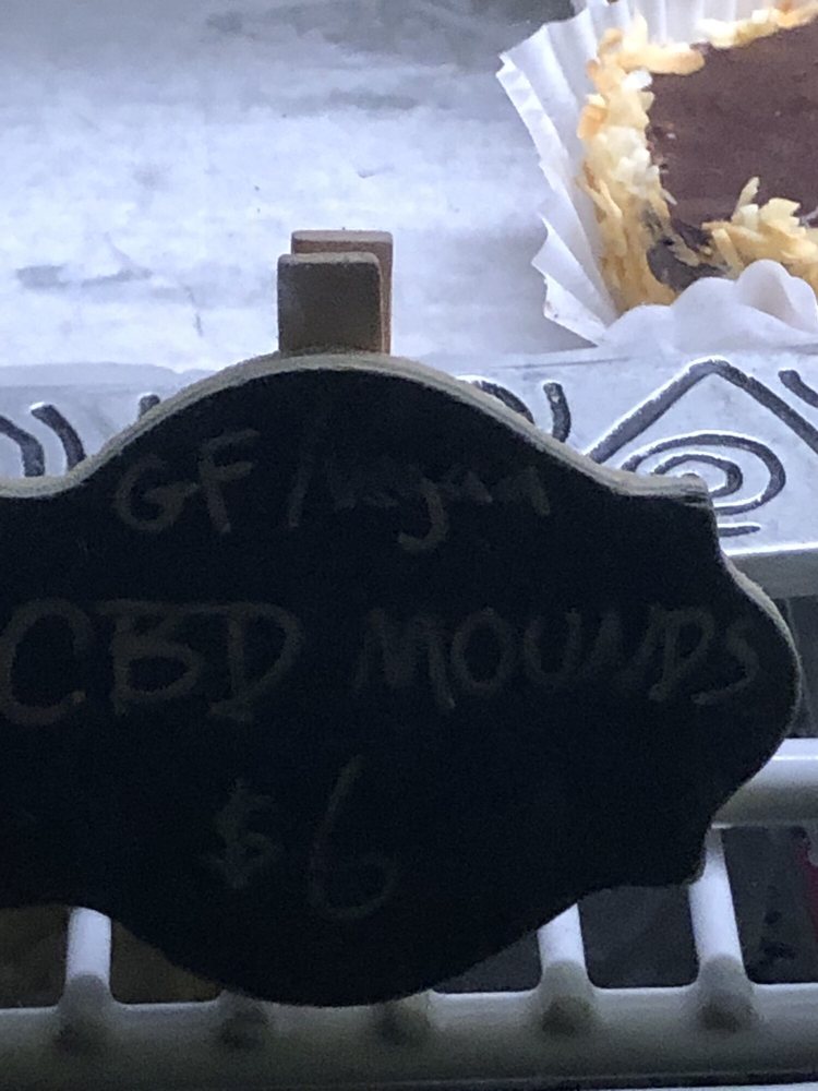 A chalk tag reading GF, vegan, CBD Mounds, $6