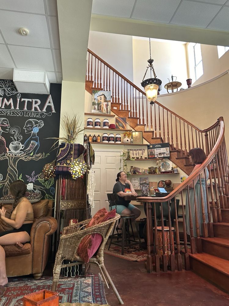 The spiral staircase and chalk mural in SumitrA's two-story lounge