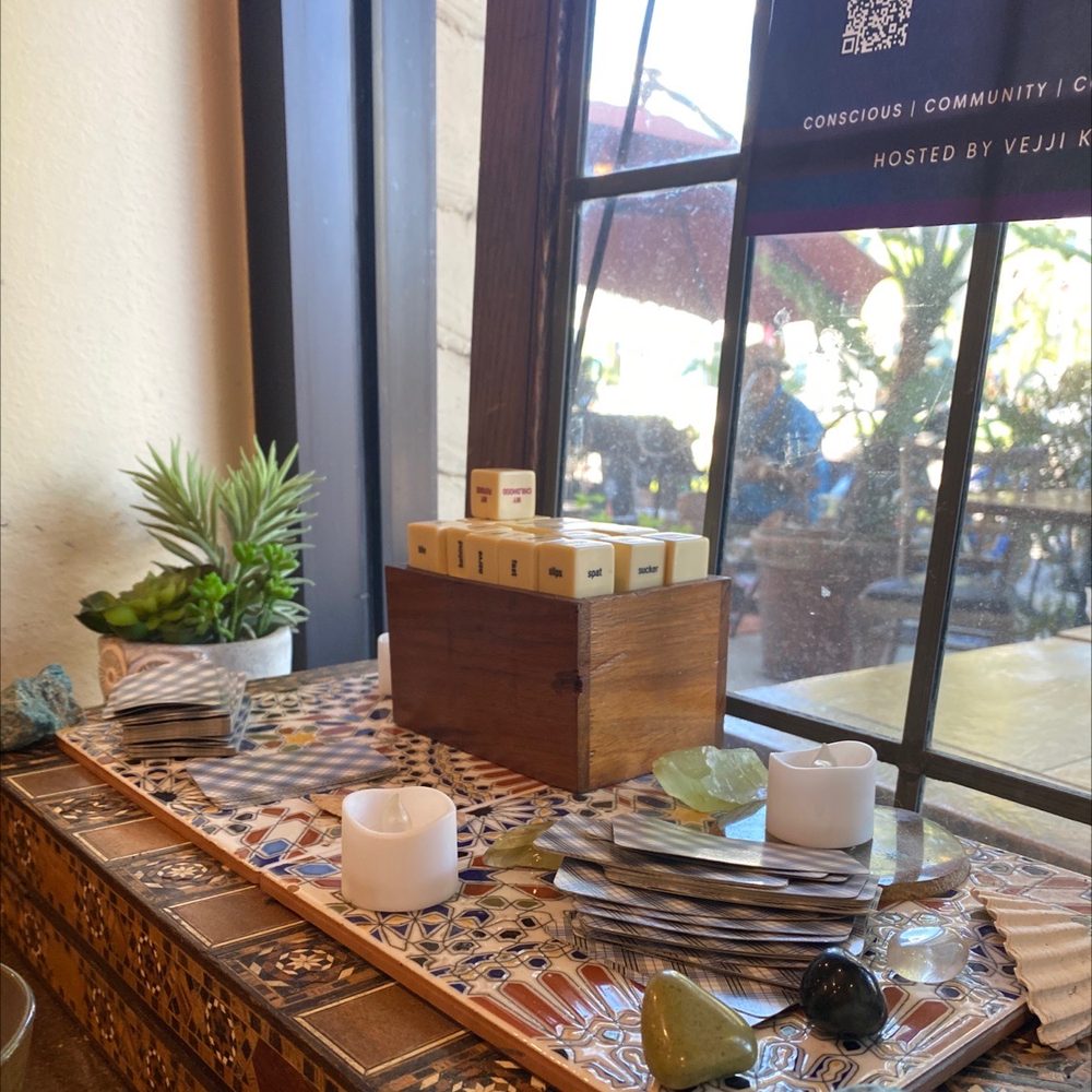 A window altar of candles, crystals and a wooden box