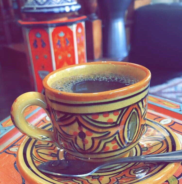 Coffee in a hand-painted Moroccan cup and saucer