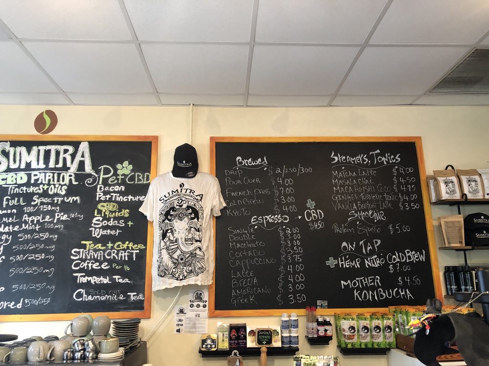 The SumitrA counter with the CBD Parlor chalkboard and the coffee menu