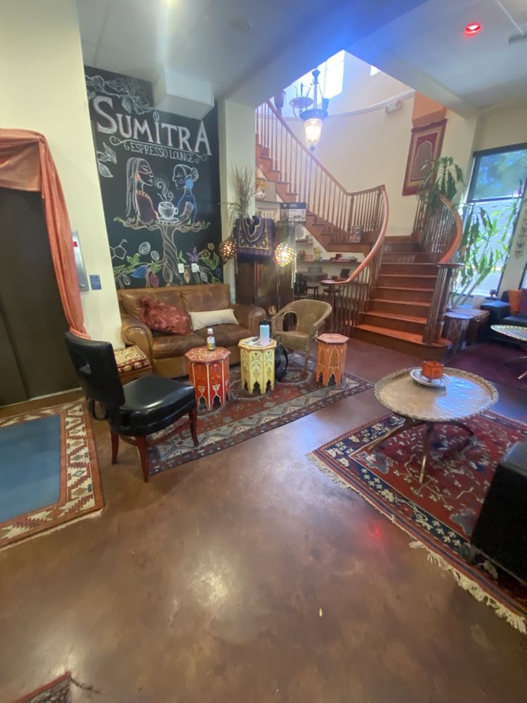 Looking up from the couches to the chalk mural and staircase