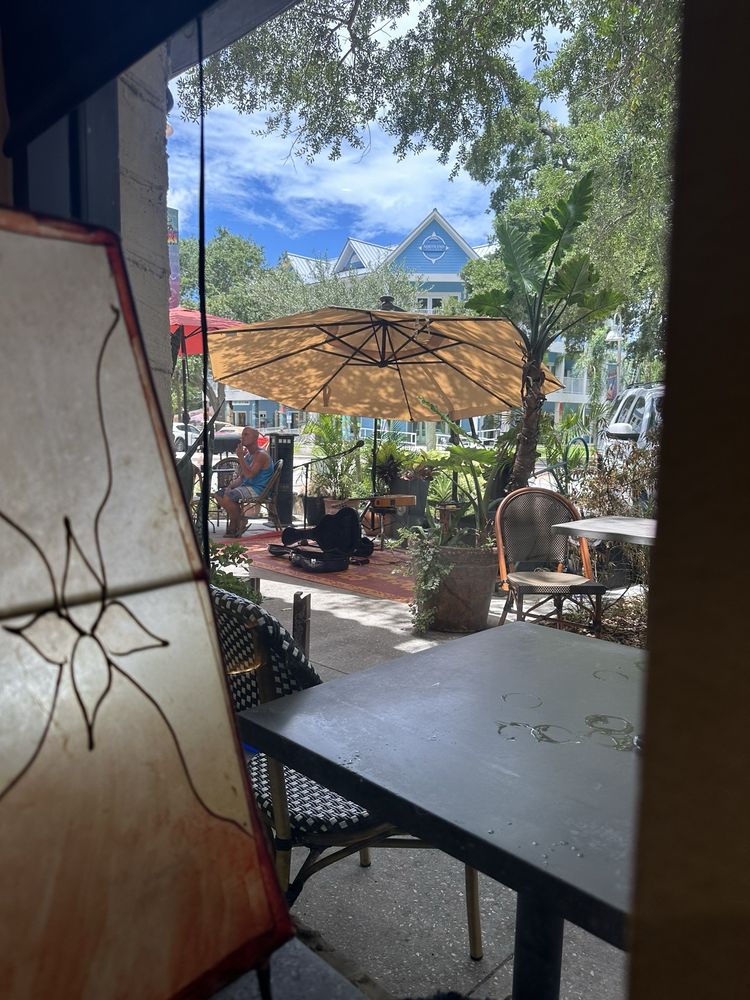 Looking out from the door to the patio umbrellas and Gulfport sky